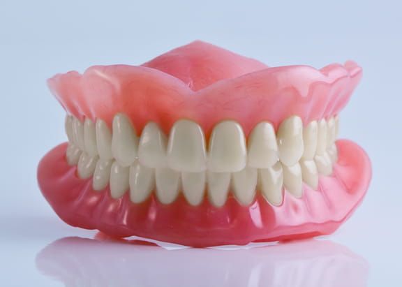 image of an upper and lower denture fitting together